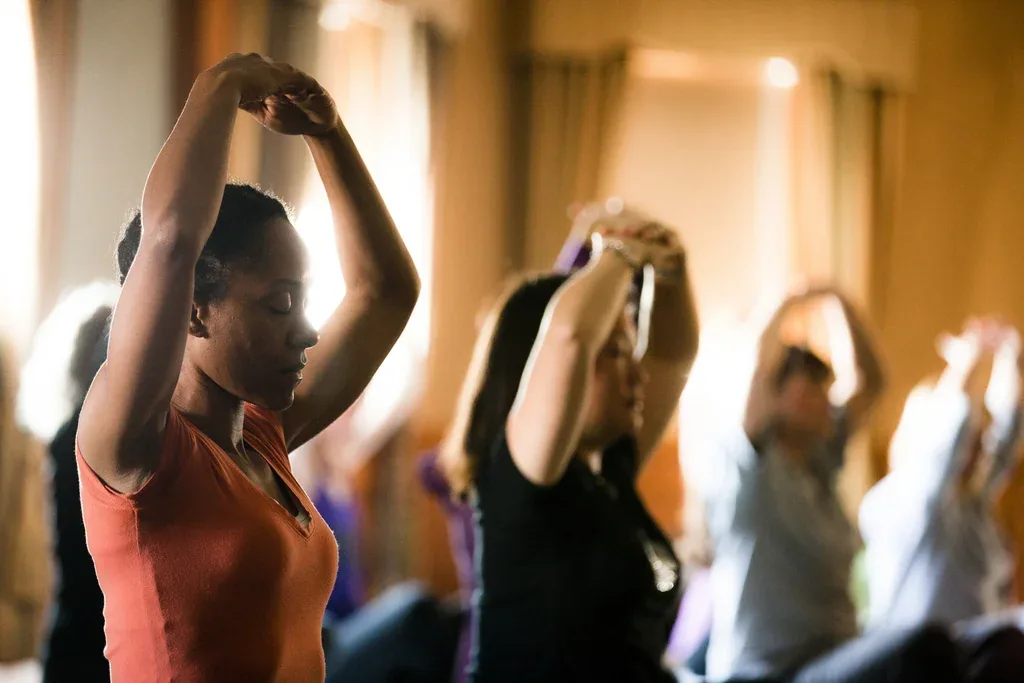 Adults practicing mindful movement together in a welcoming group setting